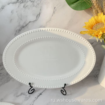 Белая фарфоровая посуда с жемчужным тиснением